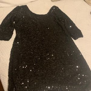 Black sequins dress . Scoop neck front and back.  Beautiful
